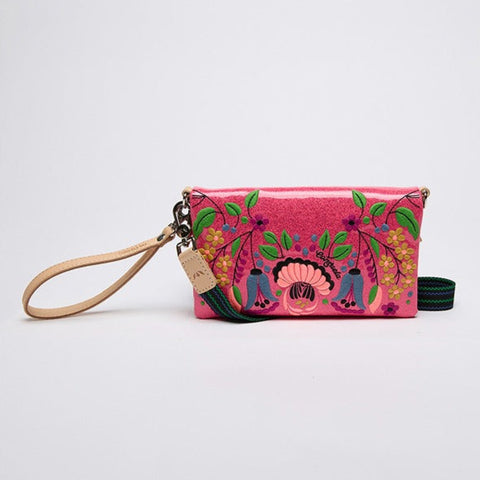Pink embroidered clutch with a strap on a white background