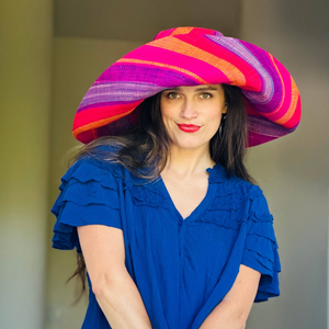 Woman wearing a colorful striped hat w