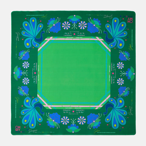 Green mahjong mat with blue floral patterns on a green background