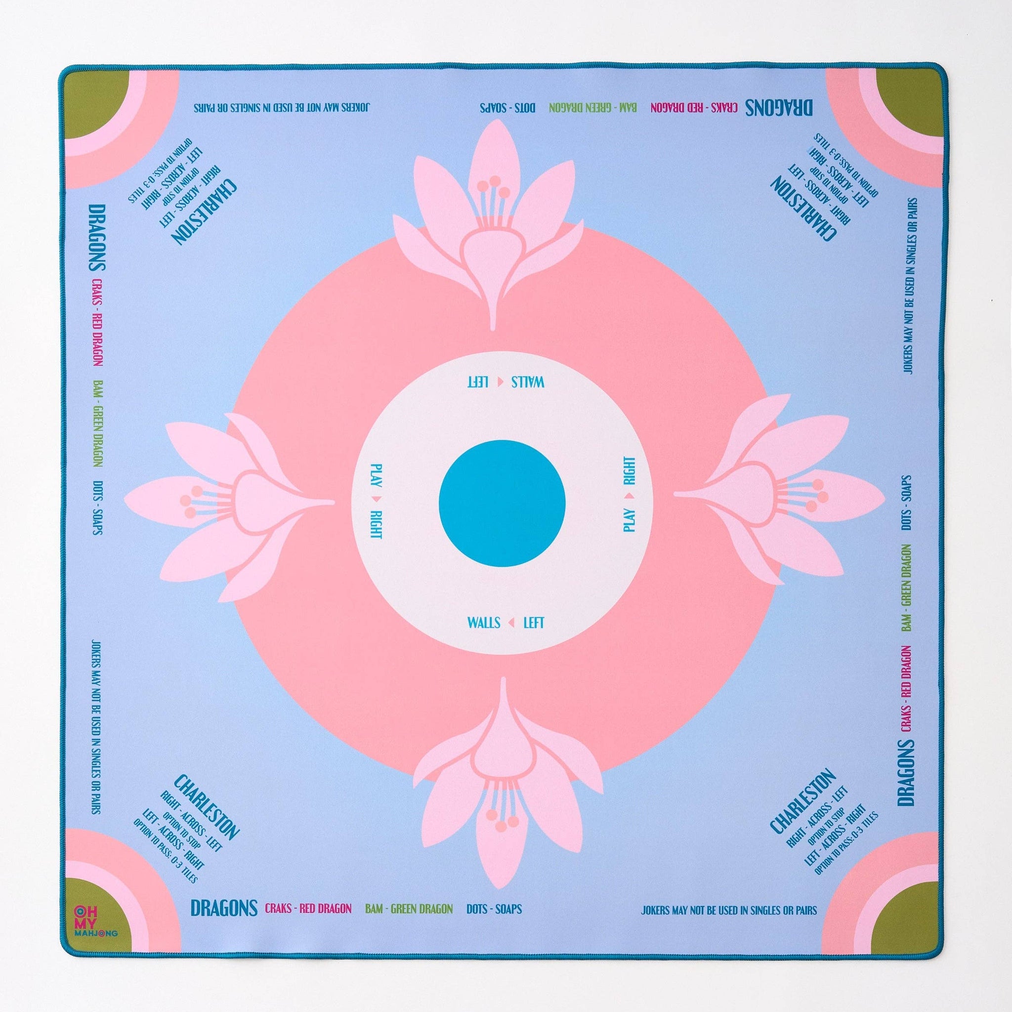 Decorative mahjong mat with pink floral design on a blue background