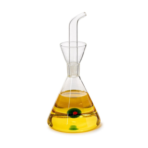 Clear glass oil dispenser with a green olive on a white background