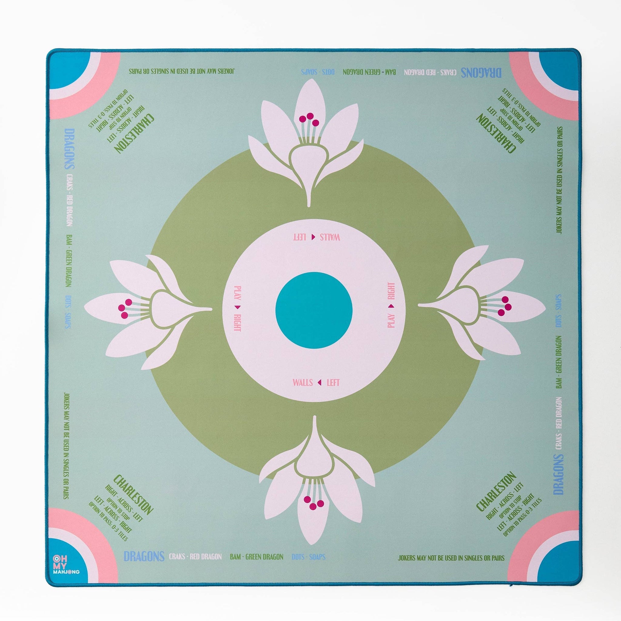 Decorative mahjong mat with floral design on a light sage blue background