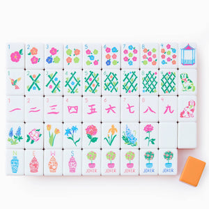 Set of colorful Mahjong tiles with floral and geometric designs on a white background
