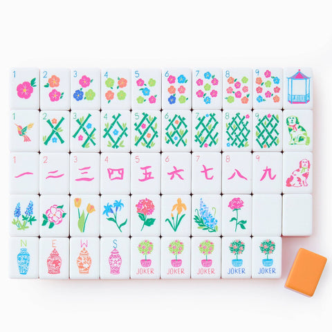 Set of colorful Mahjong tiles with floral and geometric designs on a white background