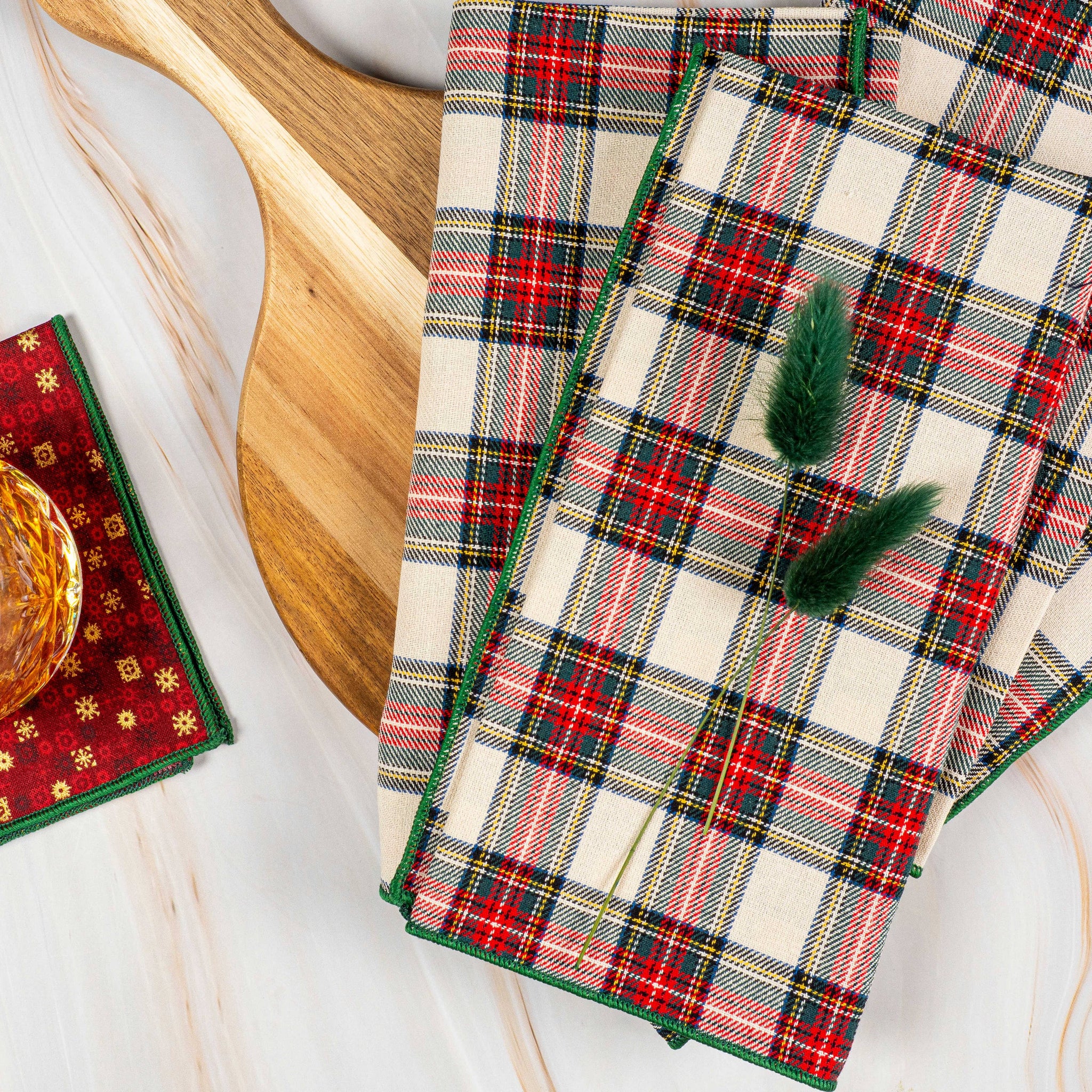 Plaid napkins on a wooden surface.