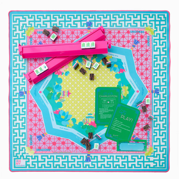 Colorful mahjong game with pieces and instructions on a decorative mat