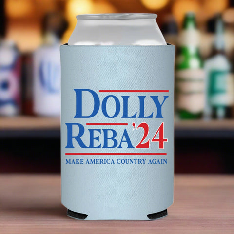 Can coozie with Dolly Reba 2024 label in red and blue on baby blue background